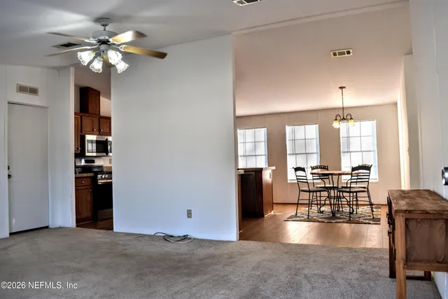 a kitchen with a stove a sink and a refrigerator