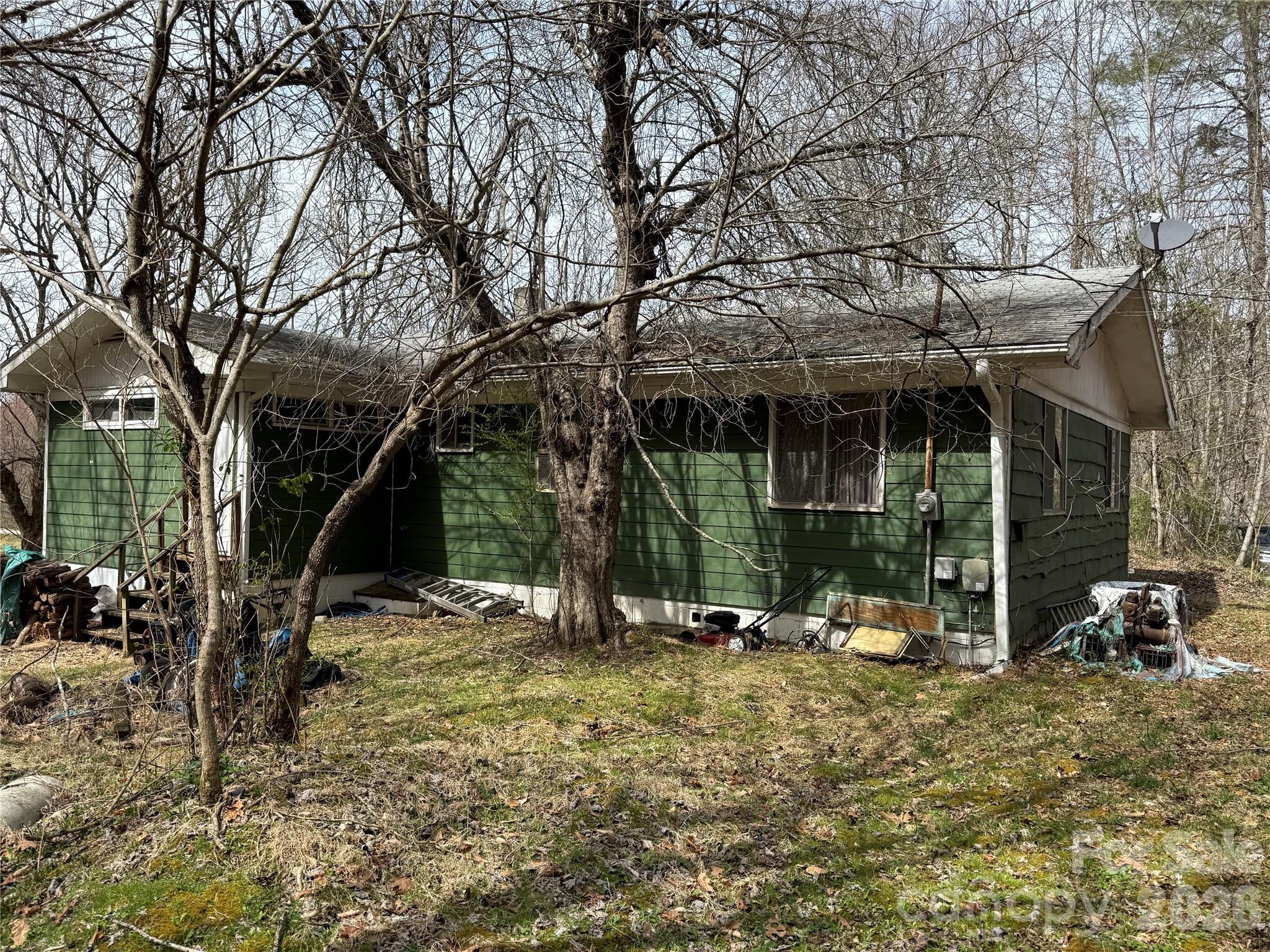 57 North Fork Road Barnardsville, NC 28709 - Photo 7 of 11 a view of backyard with wheel chair and potted plants