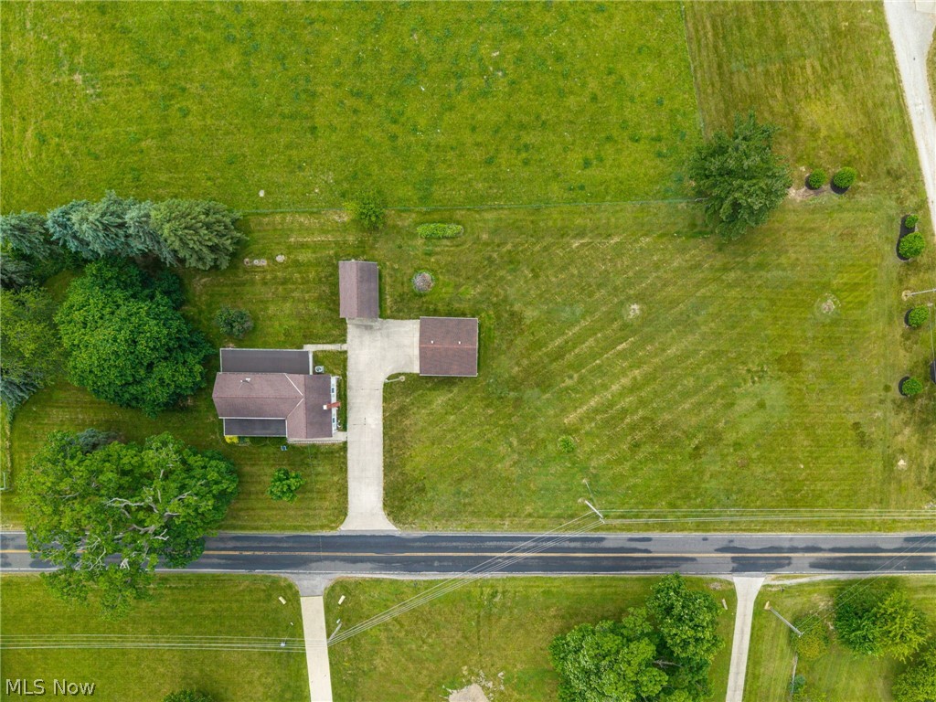 9626 Daniels Road Seville, OH 44273 - Photo 5 of 37 Property featuring a main residence, two outbuildings, and extensive green space