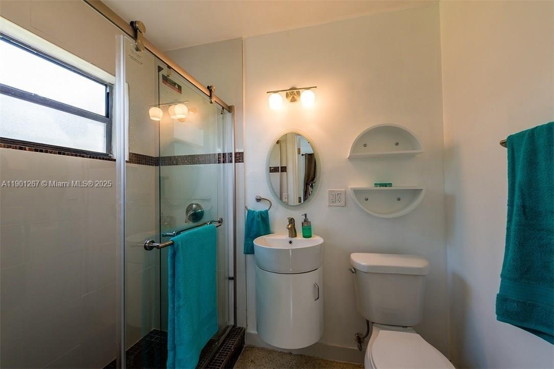 7830 Southwest 99th Street Miami, FL 33156 - Photo 8 of 10 a bathroom with a toilet and a sink