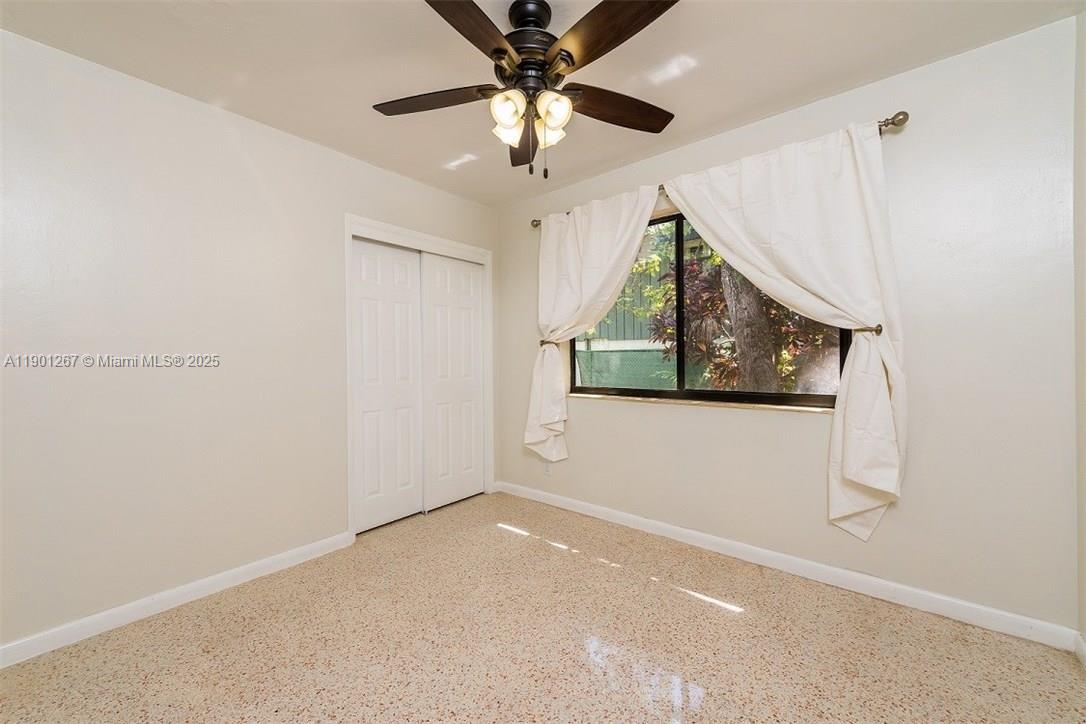 7830 Southwest 99th Street Miami, FL 33156 - Photo 10 of 10 a view of a livingroom with a ceiling fan
