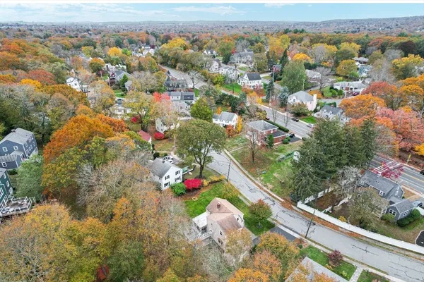 an aerial view of residential houses with outdoor space