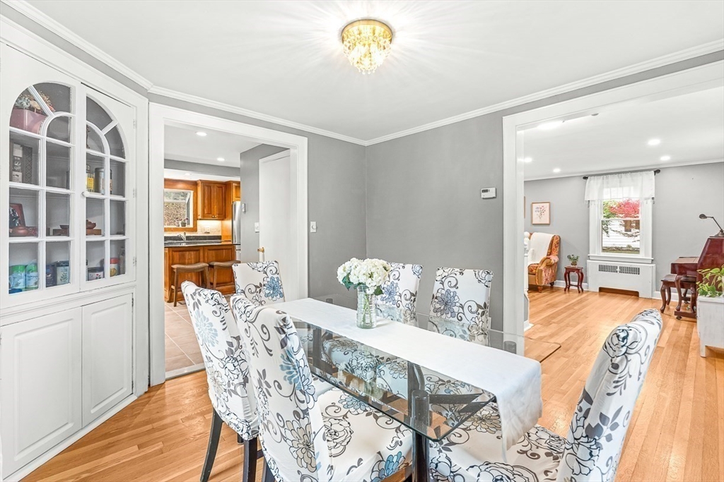 6 Marchant Road Winchester, MA 01890 - Photo 15 of 42 a view of a dining room with furniture and chandelier