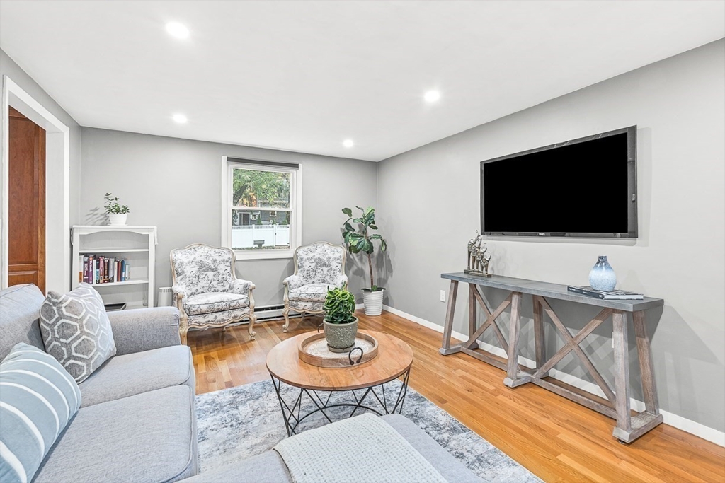 6 Marchant Road Winchester, MA 01890 - Photo 19 of 42 a living room with furniture and a flat screen tv