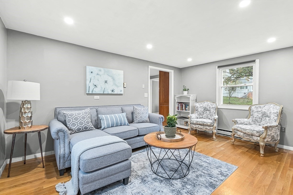 6 Marchant Road Winchester, MA 01890 - Photo 20 of 42 a living room with furniture a rug and a large window