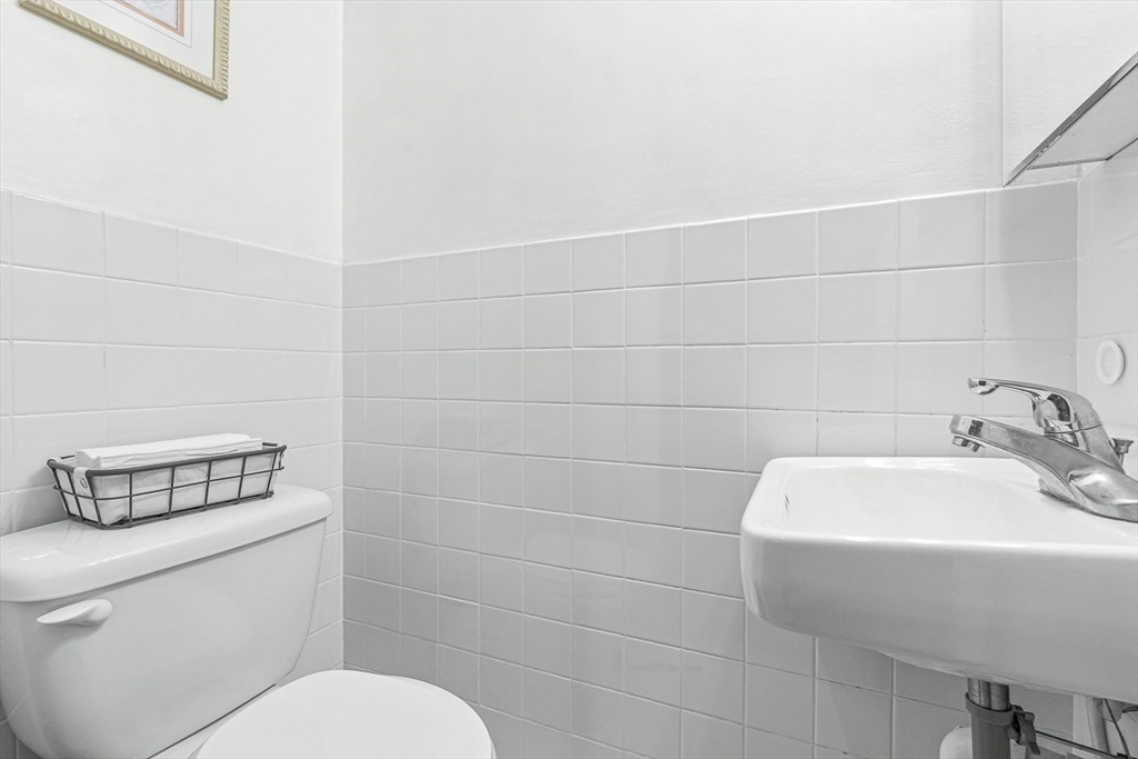 6 Marchant Road Winchester, MA 01890 - Photo 21 of 42 a bathroom with a toilet sink and mirror