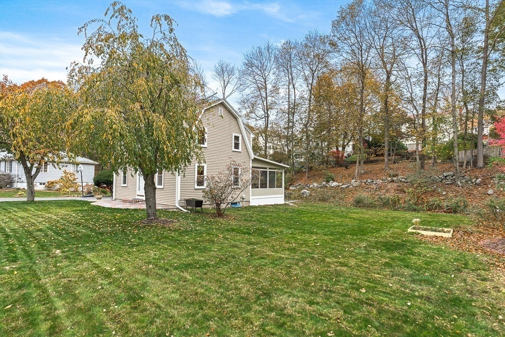 6 Marchant Road Winchester, MA 01890 - Photo 37 of 42 a view of a house with a yard