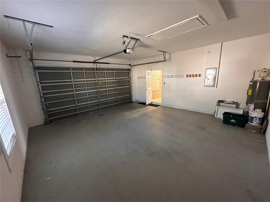 4962 Rock Rose Loop Sanford, FL 32771 - Photo 14 of 27 a view of a garage with furniture