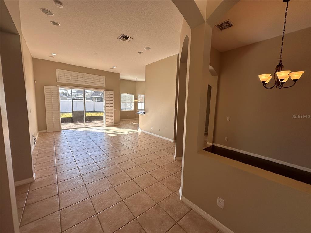4962 Rock Rose Loop Sanford, FL 32771 - Photo 2 of 27 a view of a hallway with an empty room