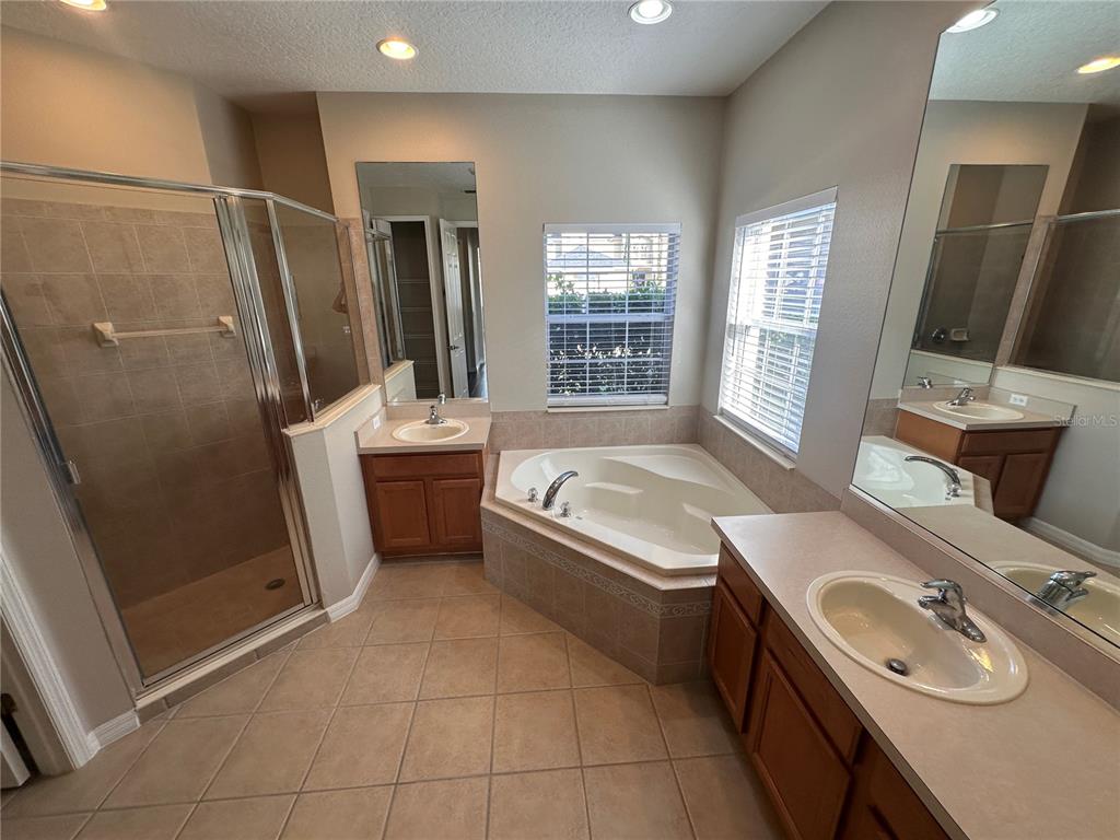 4962 Rock Rose Loop Sanford, FL 32771 - Photo 22 of 27 a bathroom with a granite countertop sink toilet and shower