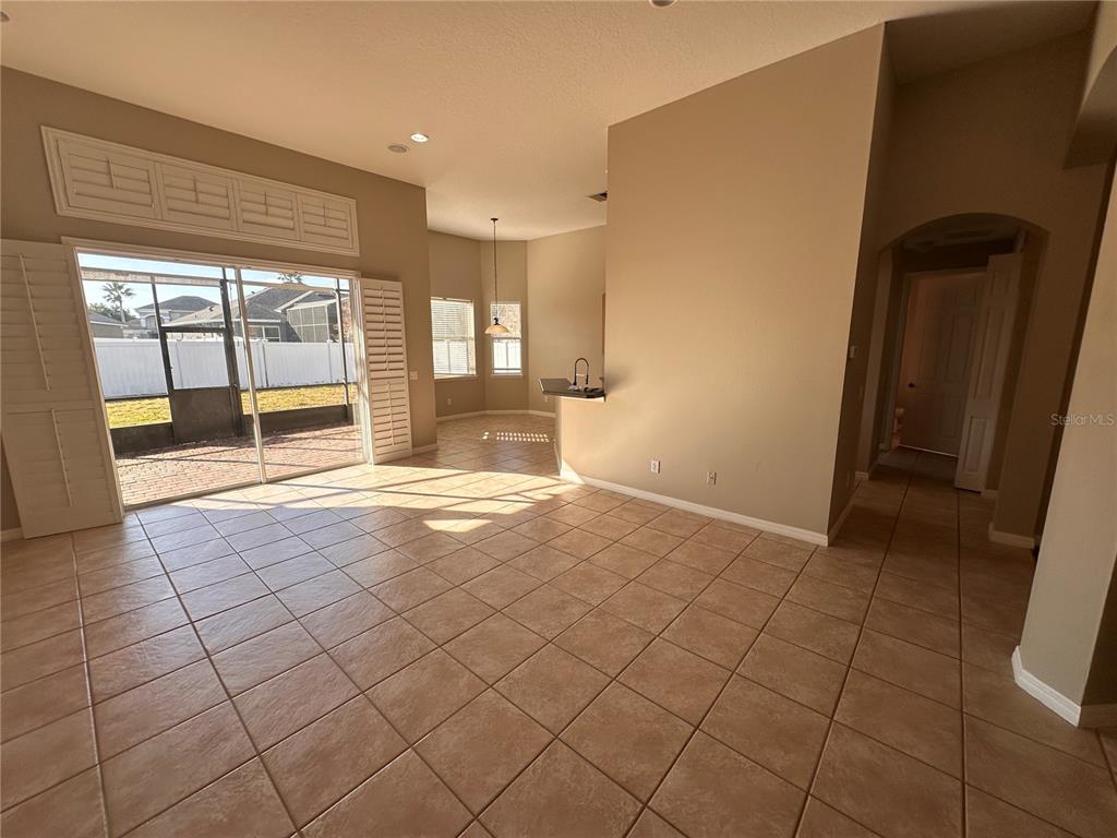 4962 Rock Rose Loop Sanford, FL 32771 - Photo 5 of 27 a view of empty room with wooden floor and fan