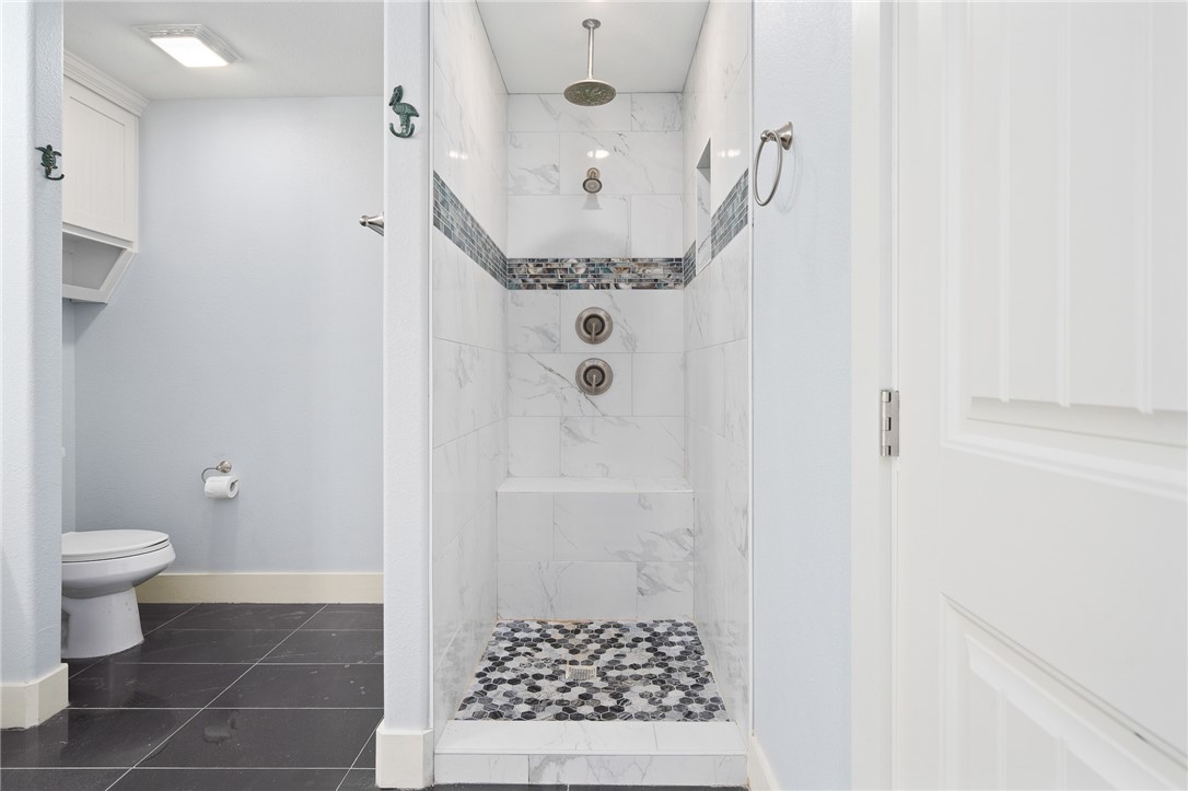 4331 Callicoatte Road Robstown, TX 78380 - Photo 19 of 40 a bathroom with a sink a toilet and shower