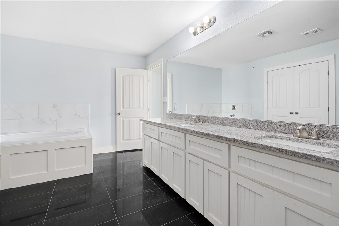 4331 Callicoatte Road Robstown, TX 78380 - Photo 20 of 40 a bathroom with a sink and a bathtub