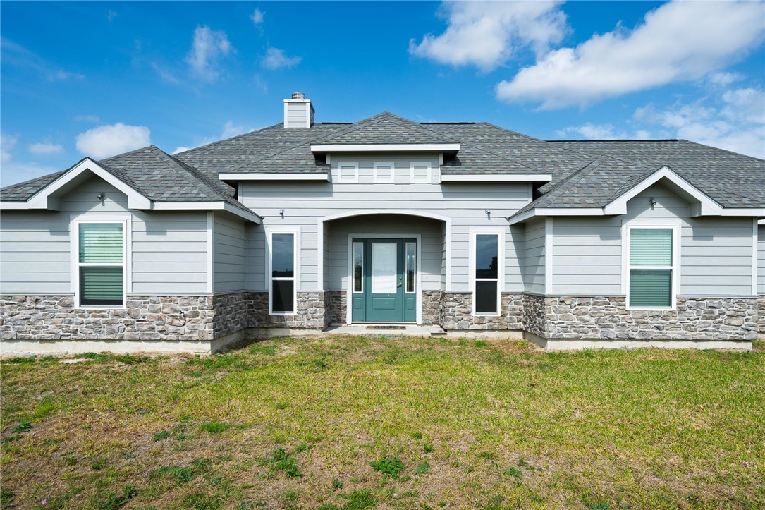 4331 Callicoatte Road Robstown, TX 78380 - Photo 2 of 40 a front view of a house with a garden