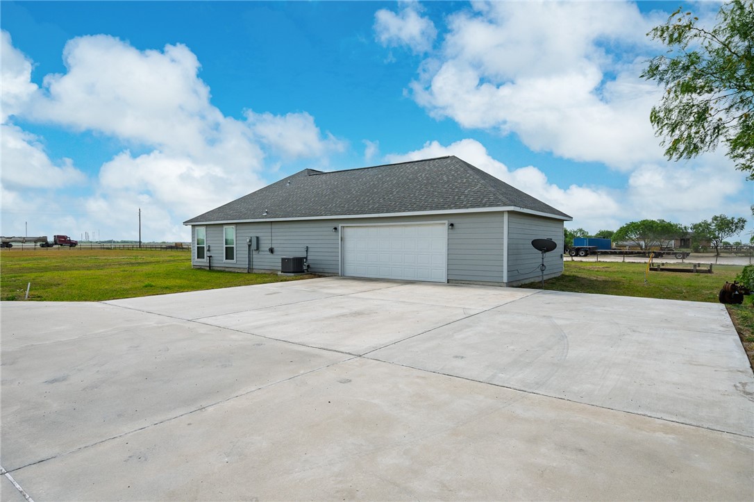 4331 Callicoatte Road Robstown, TX 78380 - Photo 28 of 40 a house with yard in front of it