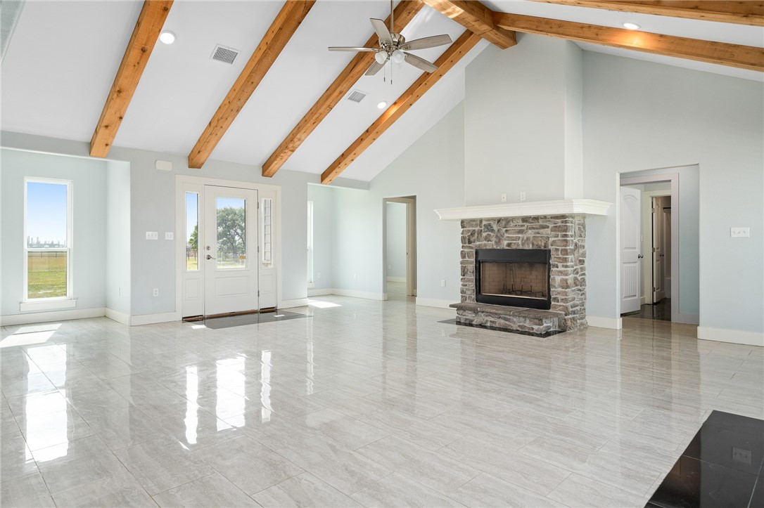 4331 Callicoatte Road Robstown, TX 78380 - Photo 7 of 40 a view of an empty room with a fireplace and a window