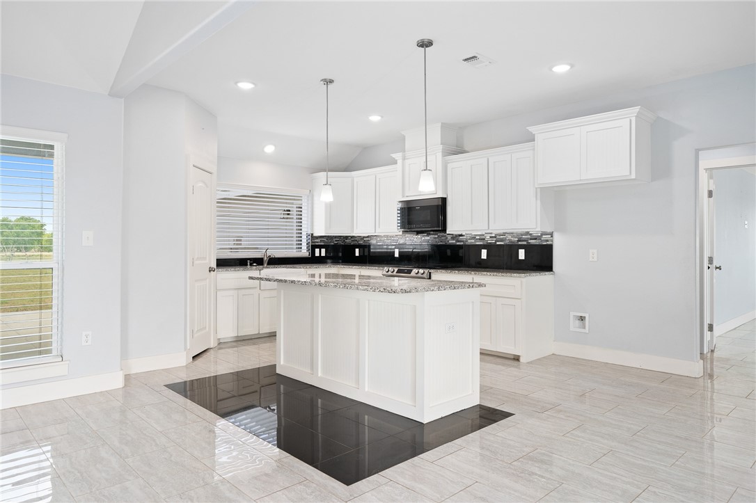 4331 Callicoatte Road Robstown, TX 78380 - Photo 9 of 40 a view of kitchen with stainless steel appliances sink refrigerator and microwave