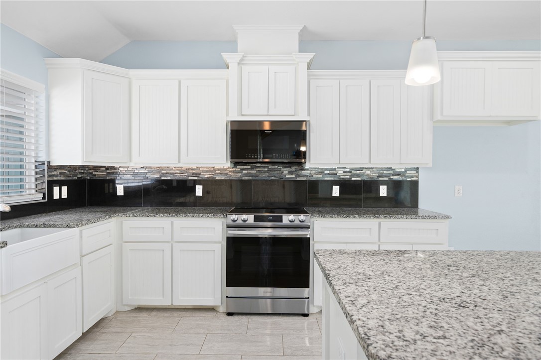4331 Callicoatte Road Robstown, TX 78380 - Photo 10 of 40 a kitchen with cabinets a sink and appliances