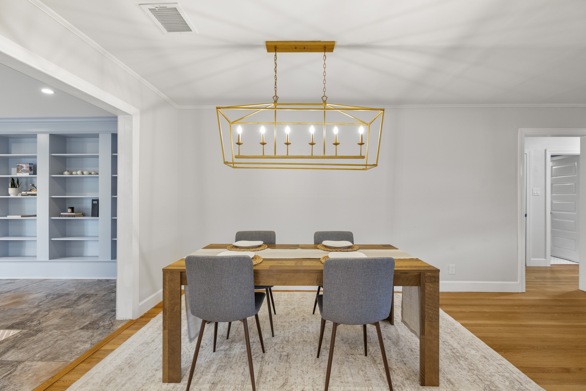 810 Nashua Street Houston, TX 77008 - Photo 14 of 35 a view of a dining room with furniture a chandelier and wooden floor