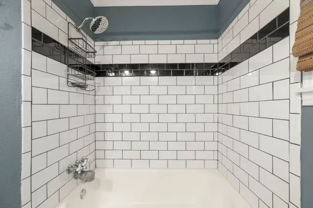 a view of a kitchen with a sink and wooden floor
