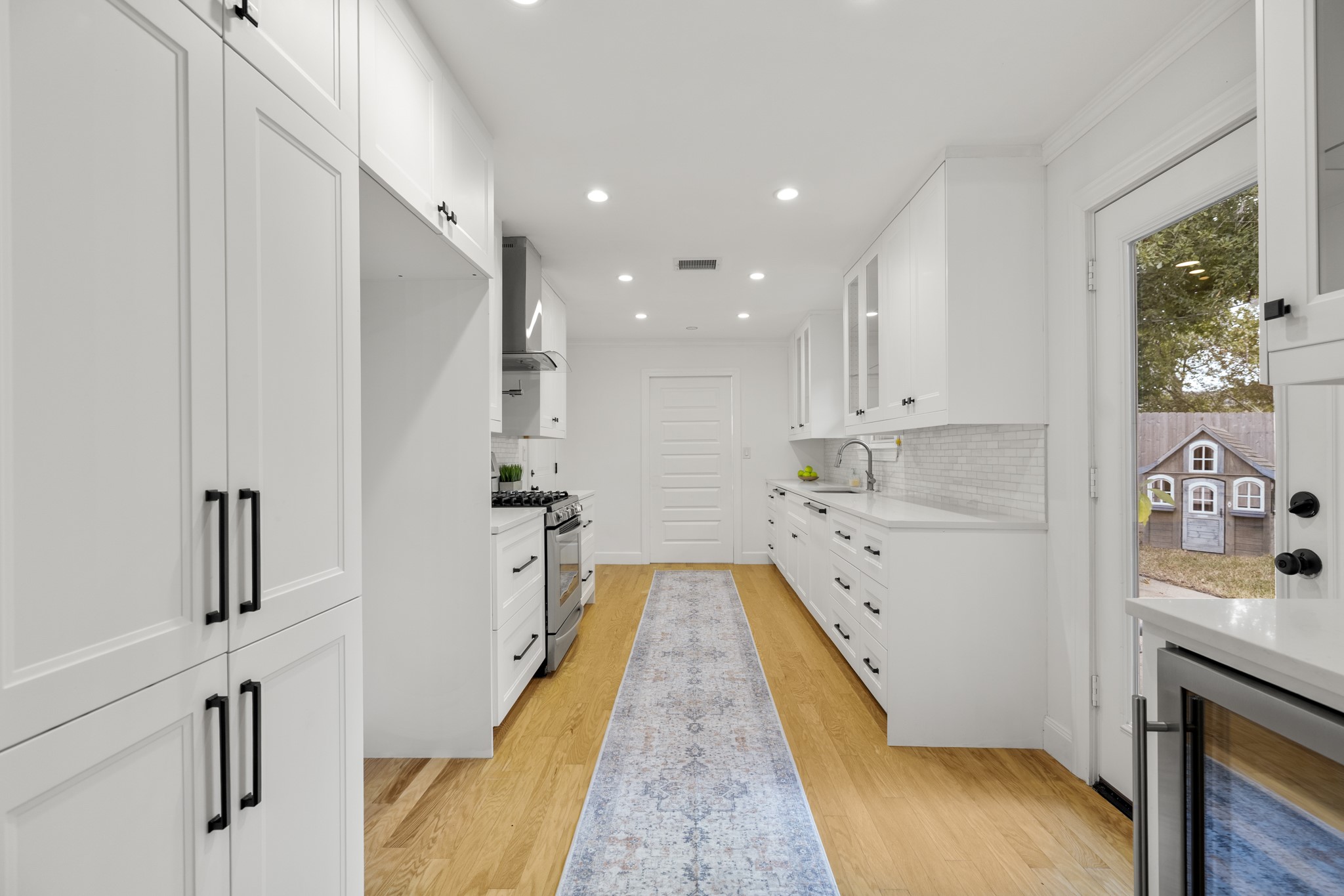 810 Nashua Street Houston, TX 77008 - Photo 20 of 35 a view of a kitchen with a sink and wooden floor
