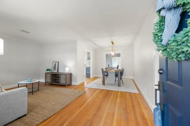 a living room with furniture and a table