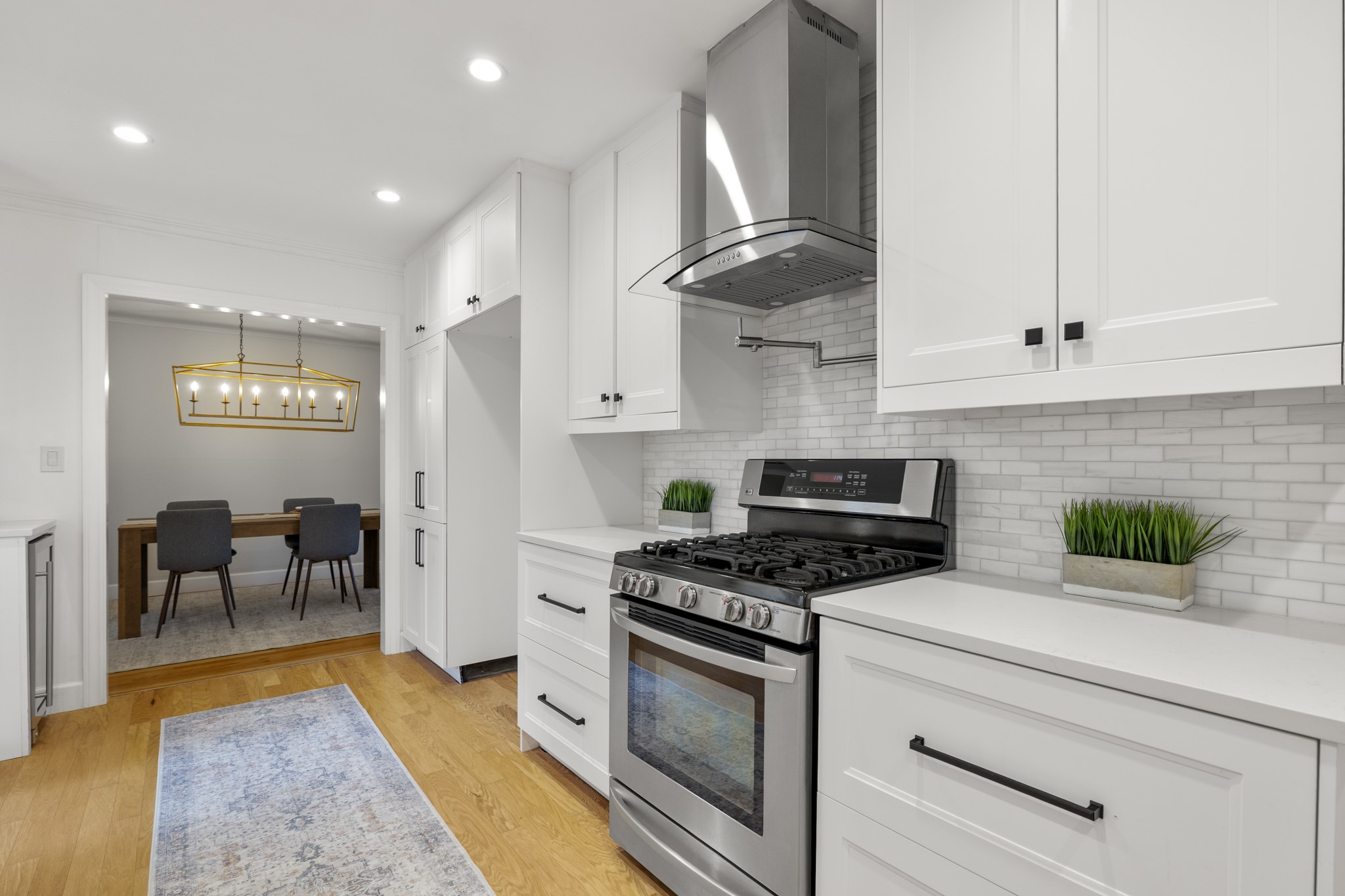 810 Nashua Street Houston, TX 77008 - Photo 9 of 35 a kitchen with stainless steel appliances a stove a sink and a refrigerator