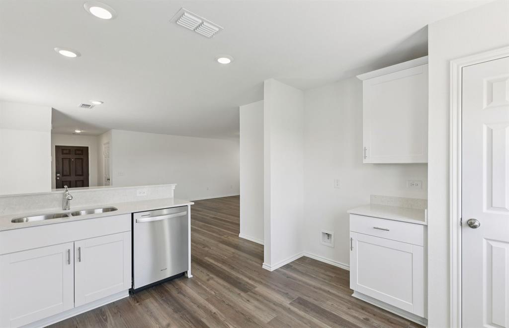 828 Springwell Drive Princeton, TX 75407 - Photo 9 of 17 *Floorplan representation, not actual home - Spacious kitchen with eat-in bartop