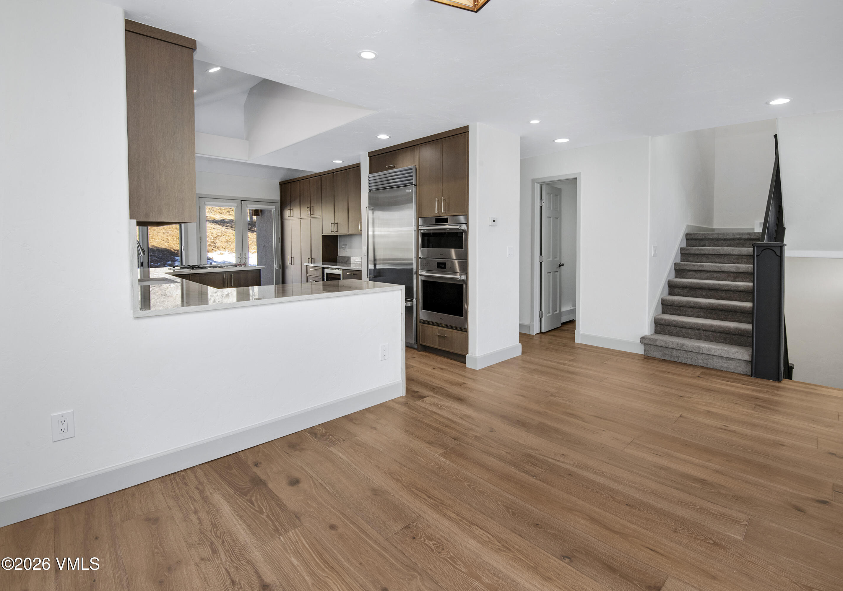 567 Singletree Road Edwards, CO 81632 - Photo 17 of 38 a view of a kitchen with wooden floor and electronic appliances