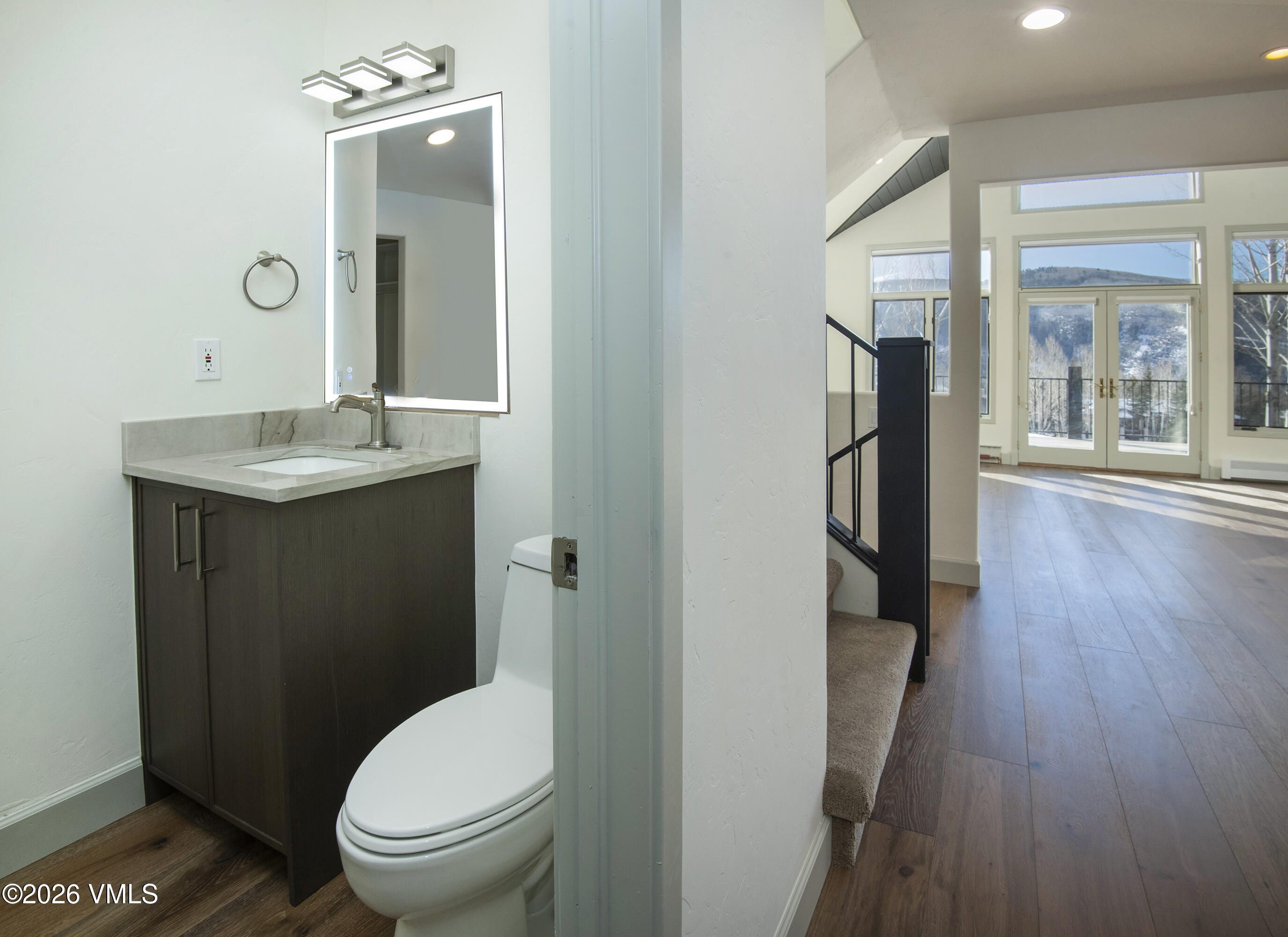 567 Singletree Road Edwards, CO 81632 - Photo 19 of 38 a bathroom with a granite countertop toilet sink and shower