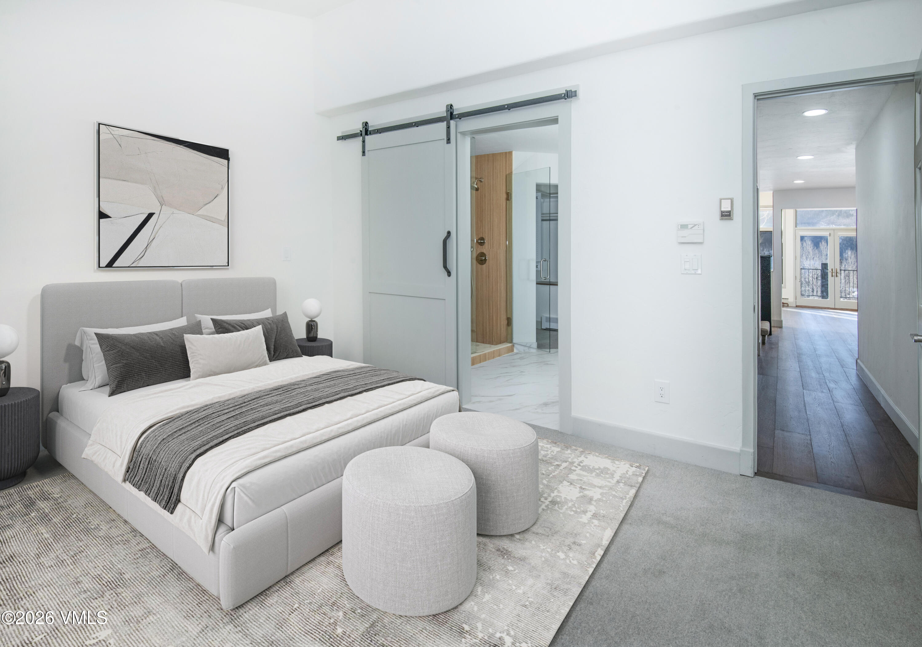 567 Singletree Road Edwards, CO 81632 - Photo 21 of 38 a spacious bedroom with a bed and a painting