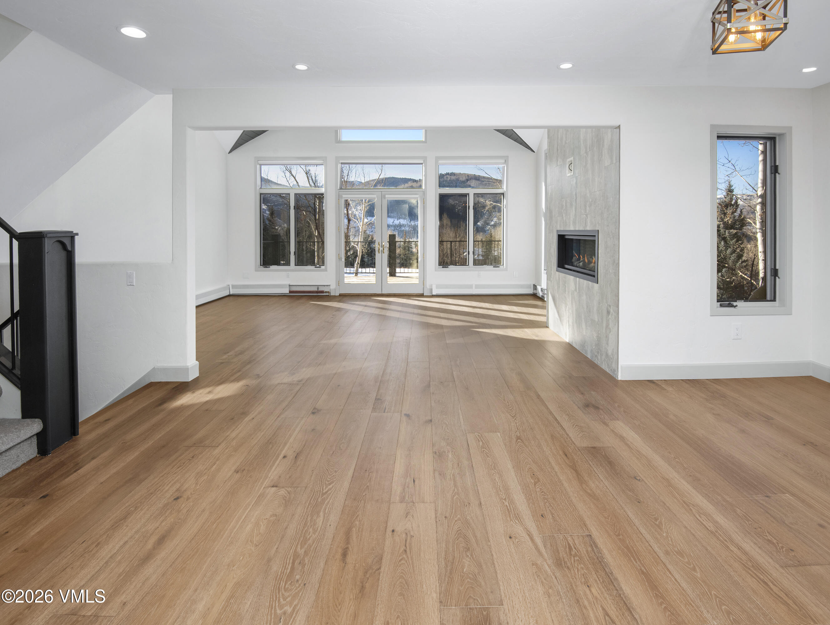 567 Singletree Road Edwards, CO 81632 - Photo 5 of 38 wooden floor in an empty room with a window