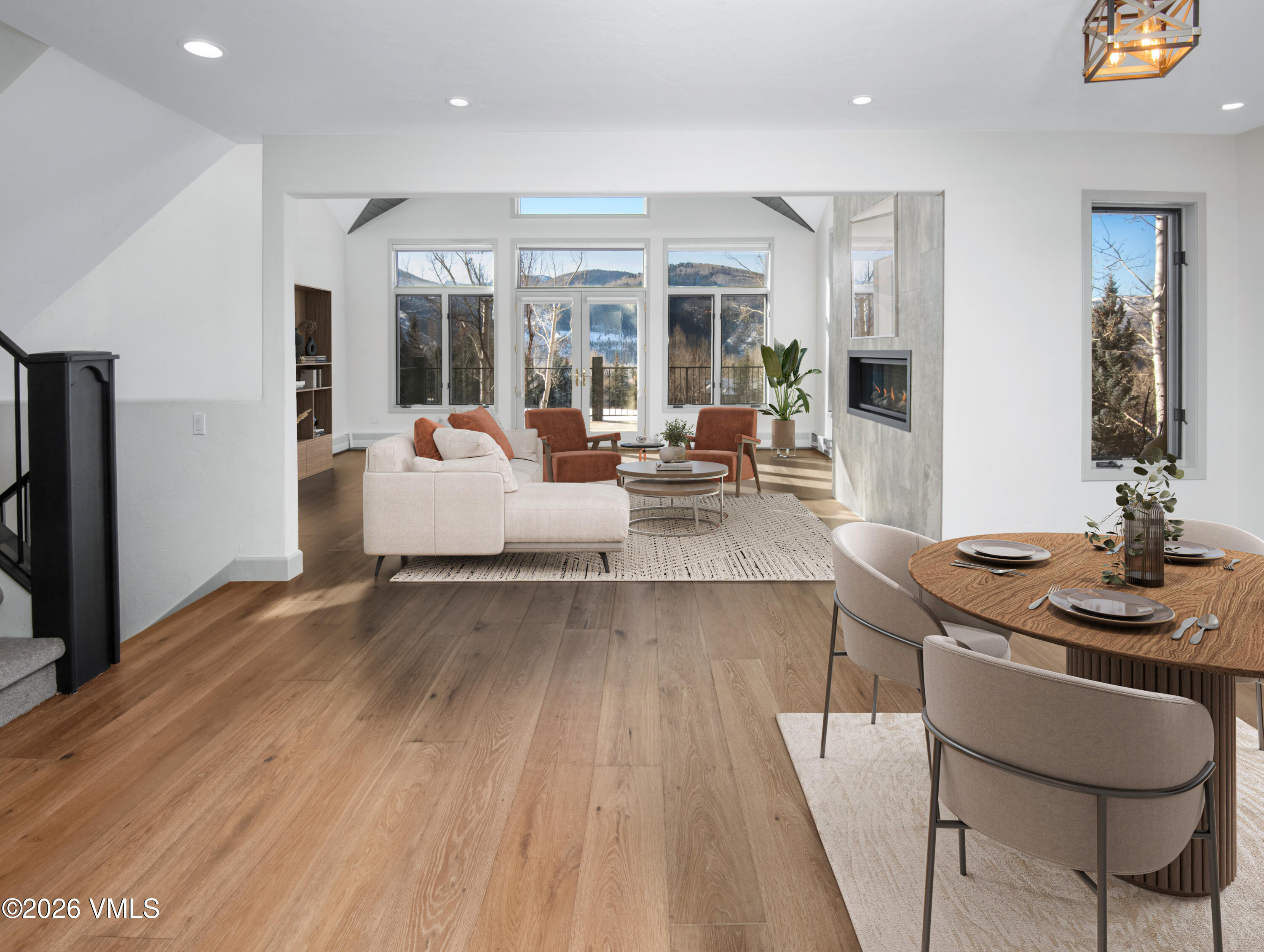 567 Singletree Road Edwards, CO 81632 - Photo 6 of 38 a living room with furniture floor to ceiling window and wooden floor