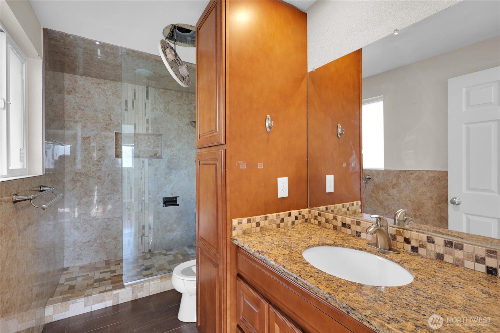 18518 131st Avenue Southeast Renton, WA 98058 - Photo 18 of 34 a bathroom with a sink a toilet and shower
