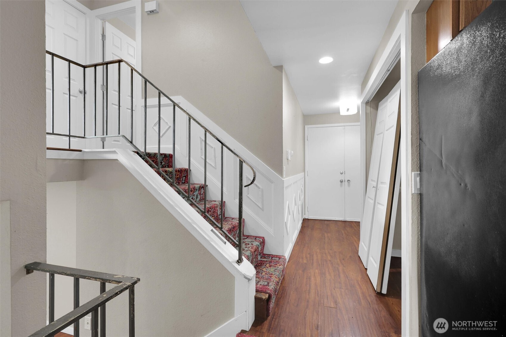 18518 131st Avenue Southeast Renton, WA 98058 - Photo 21 of 34 a view of staircase with wooden floor and white walls