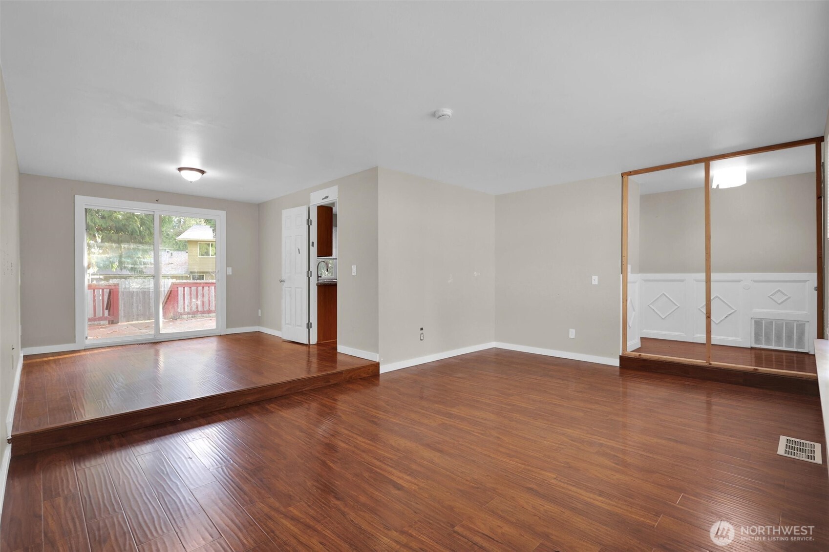 18518 131st Avenue Southeast Renton, WA 98058 - Photo 24 of 34 an empty room with wooden floor and windows
