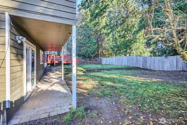 a view of balcony with wooden floor and outdoor seating