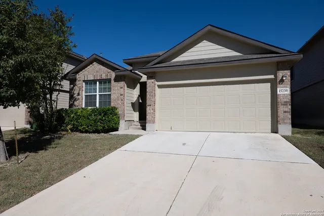 a front view of a house with yard