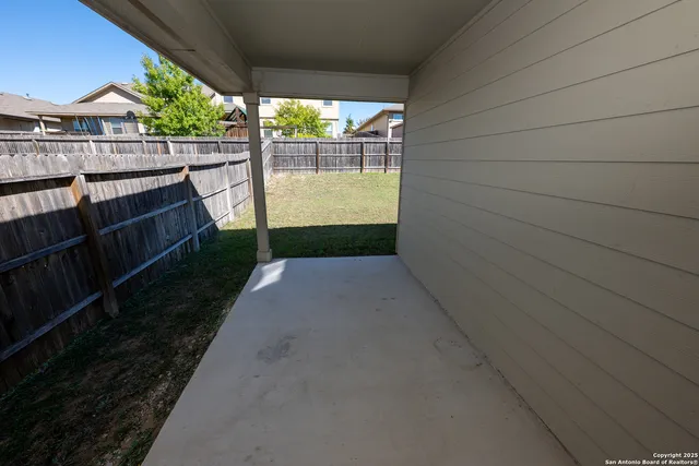 a view of a pathway with a backyard