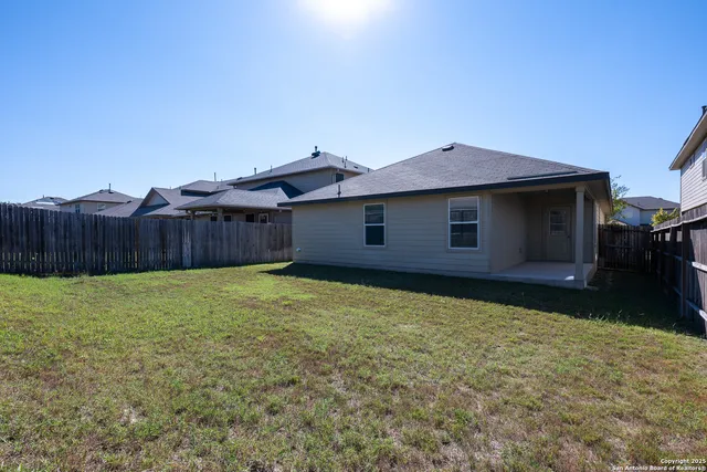 a house view with a backyard space