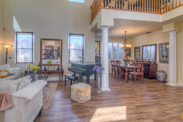 a living room with furniture and wooden floor