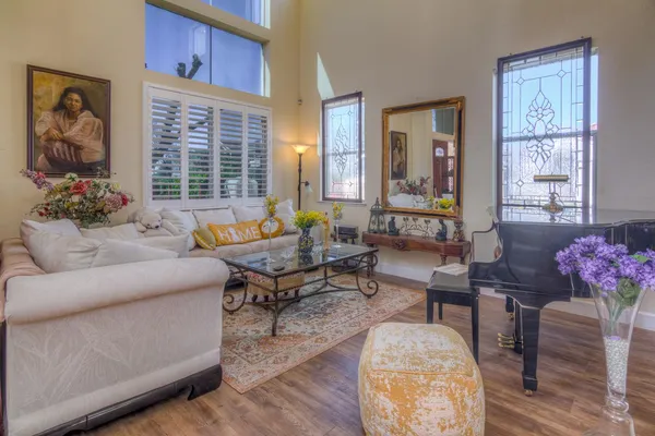 a view of a dining room with furniture and wooden floor