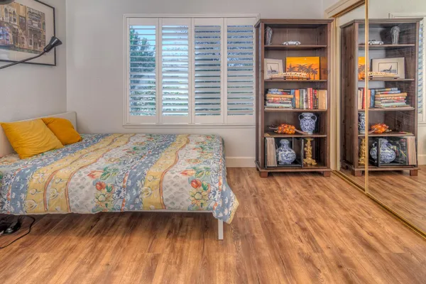 a kitchen with kitchen island granite countertop a sink stove and refrigerator