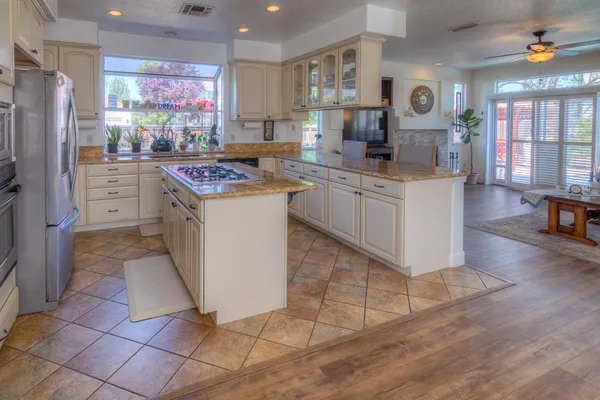 a kitchen with lots of counter top space and wooden floor