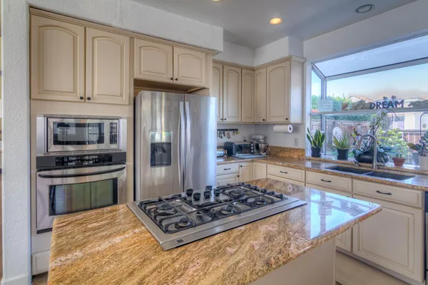 a living room with fireplace furniture and a wooden floor