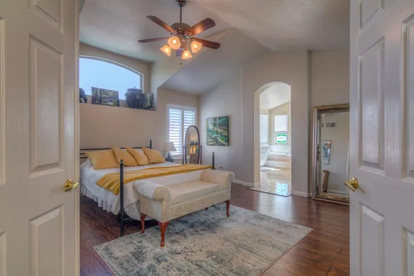 a bathroom with a granite countertop sink and a window