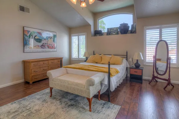 a bathroom with a granite countertop sink a vanity and a mirror