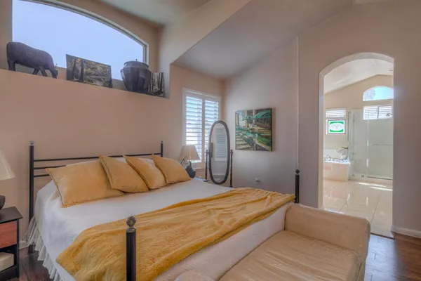 a view of a house with a yard and potted plants