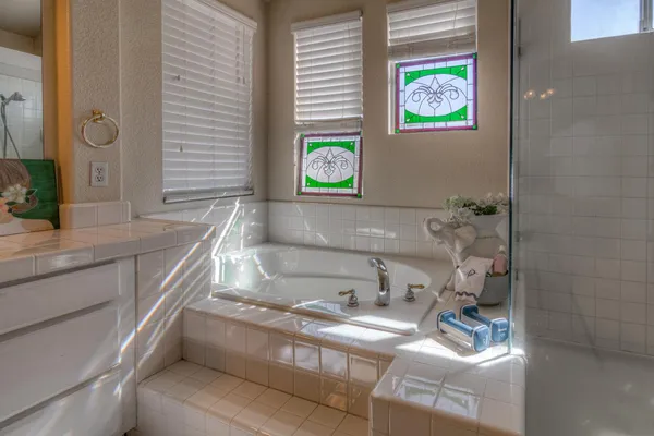 a view of a balcony with chair and wooden floor