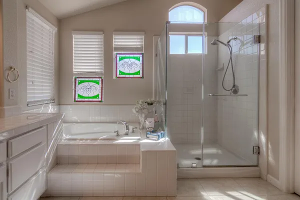 a view of a patio with table and chairs under an umbrella